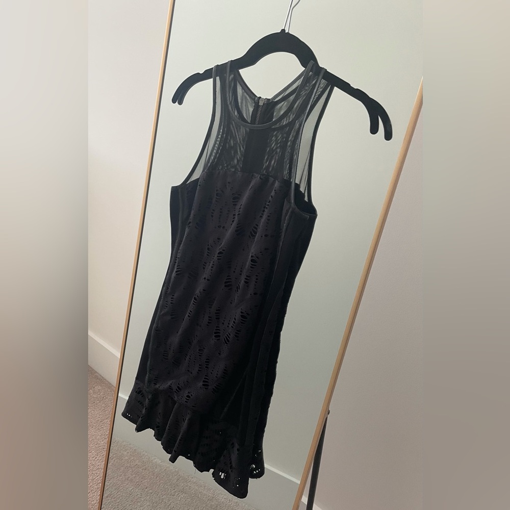 Fun black mini dress with no damage. An edgy and fun LBD from Revolve.